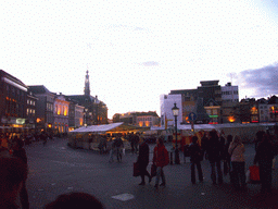 Market stalls and the City Hall at the Markt square, at sunset