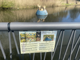 Statue of a figure from the painting `The Garden of Earthly Delights` of Hieronymus Bosch, at the west side of the Stadsgracht canal at the Zuiderpark, with explanation