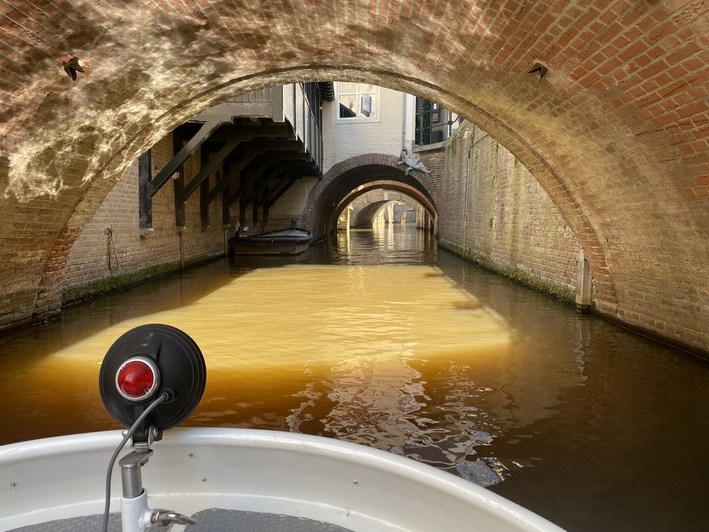 Buildings over the Binnendieze river at the Molenstraat street, viewed from the tour boat