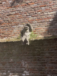 Statue of a monkey, viewed from the tour boat on the Binnendieze river