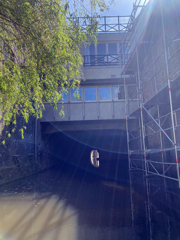 Buildings over the Binnendieze river at the Vughterstraat street, viewed from the tour boat