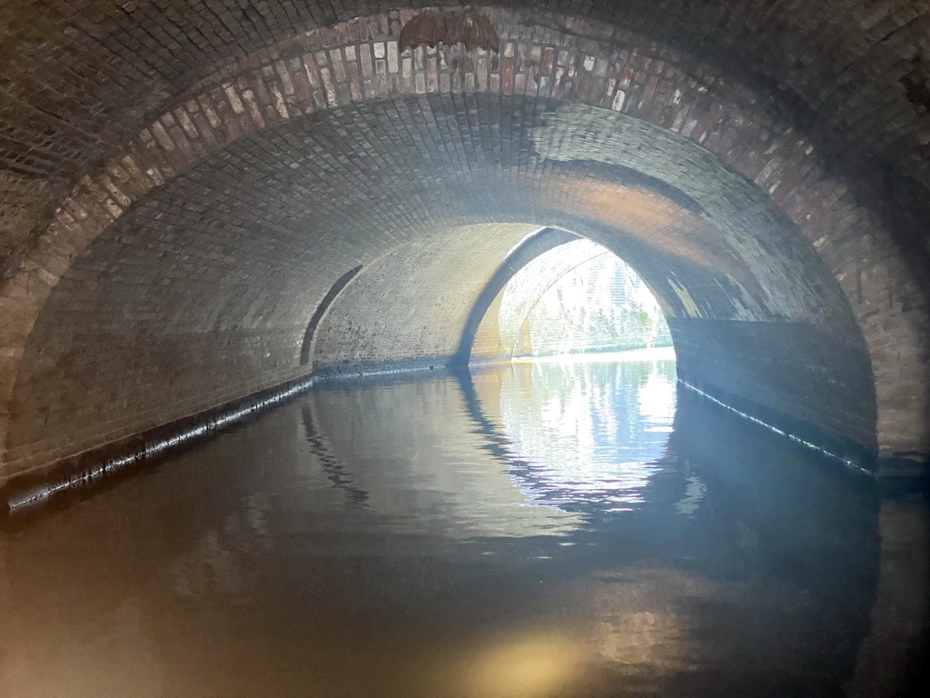 The Binnendieze river and tunnel under the Kruisbroederstraatje street, viewed from the tour boat