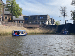 Boats on the Singelgracht canal, the Kuin & Kuin Architecten building, the Rijkswaterstaat building and the Bastion Oranje, viewed from the tour boat