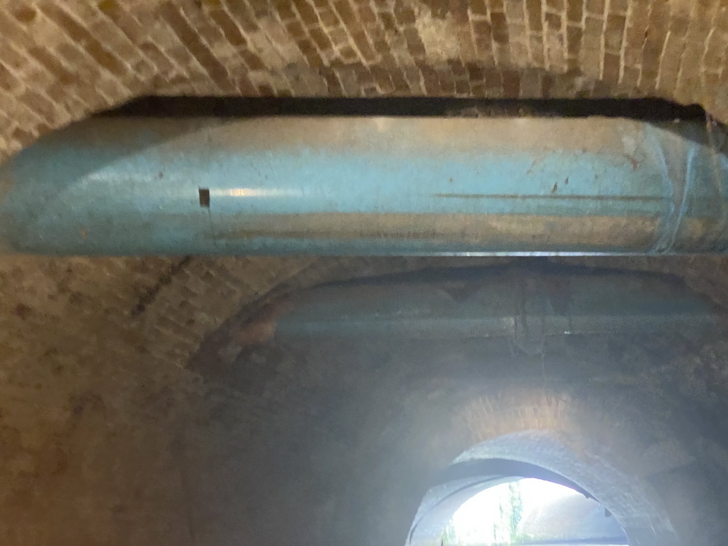 Pipes under the road and the tunnel under the City Hall, viewed from the tour boat on the Binnendieze river