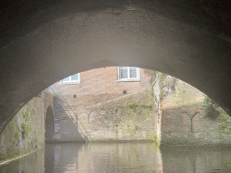 The Binnendieze river and tunnel at the Kruisstraat street, viewed from the tour boat
