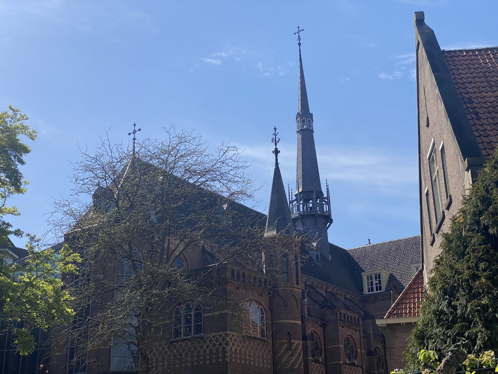 Towers of the Mariënburgklooster monastery, viewed from its garden, during the Stegenwandeling walking tour