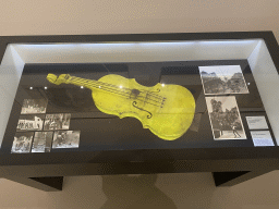 Violin and photographs of the construction and Kate Bush music video of the Spookslot attraction at the Efteling theme park, at the Efteling exhibition at the Noordbrabants Museum, with explanation