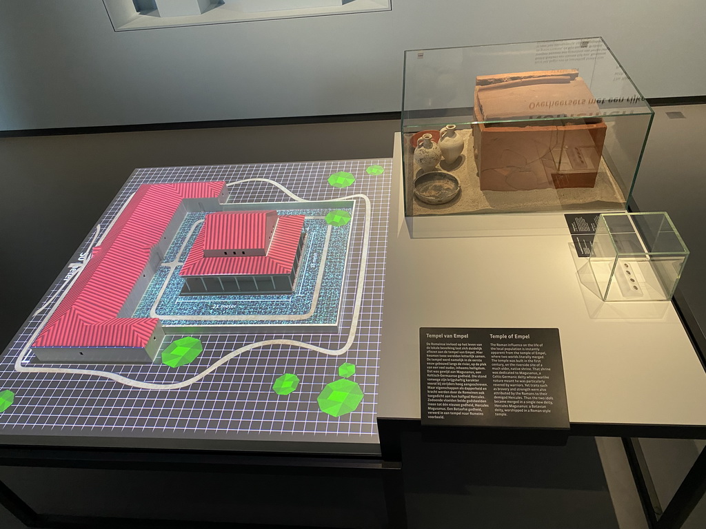 Scale model of the Temple of Empel and pottery at the `Het Verhaal van Brabant` exhibition at the Wim van der Leegtezaal room at the Noordbrabants Museum, with explanation