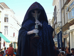 Person in medieval costume during the Queen`s Day festivities at the Hinthamerstraat street