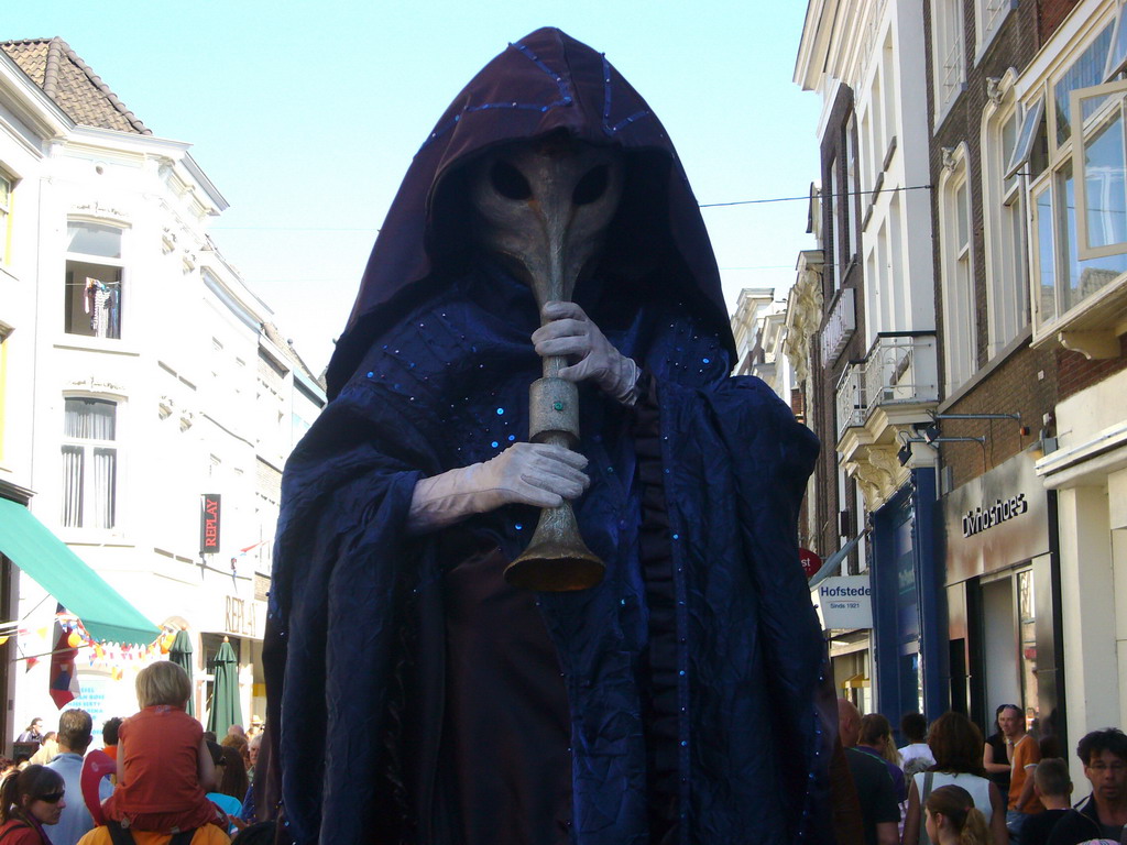 Person in medieval costume during the Queen`s Day festivities at the Hinthamerstraat street