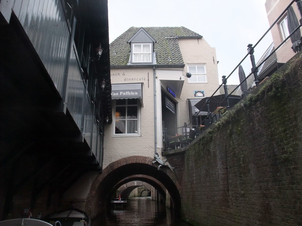 The Binnendieze river and the Van Puffelen Restaurant at the Molenstraat street, viewed from the tour boat