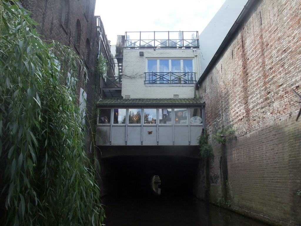 Building hanging over the Binnendieze river, viewed from the tour boat