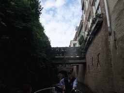 Our guide on the tour boat and bridges over the Binnendieze river