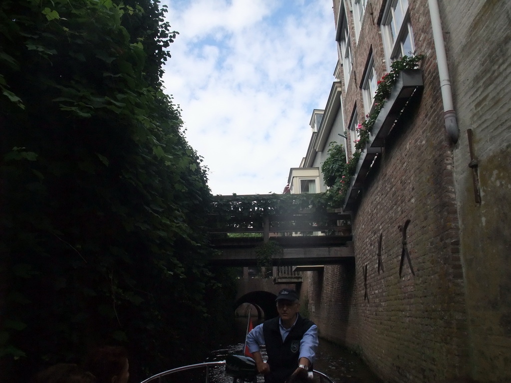 Our guide on the tour boat and bridges over the Binnendieze river