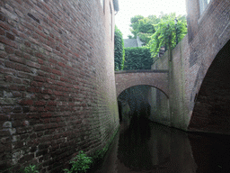 Small bridge over the Binnendieze river, viewed from the tour boat