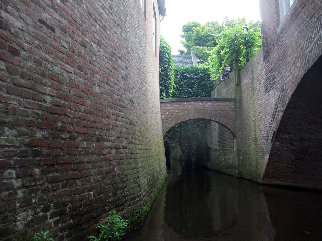 Small bridge over the Binnendieze river, viewed from the tour boat
