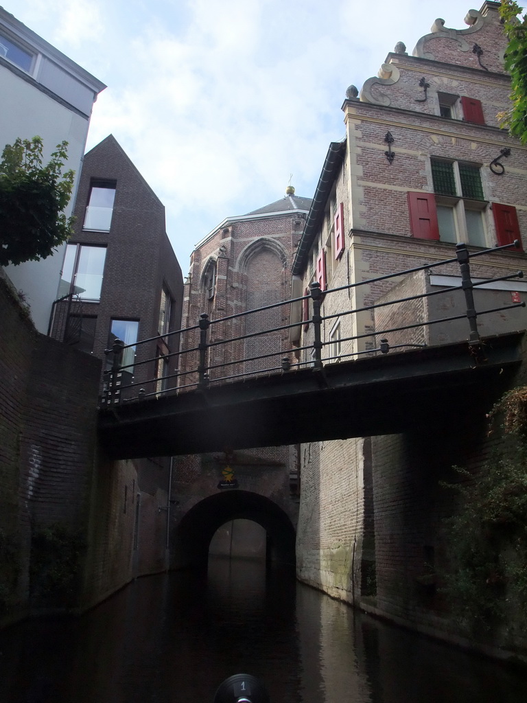 Bridge over the Binnendieze river and tunnel under the St. Catharina Church, viewed from the tour boat
