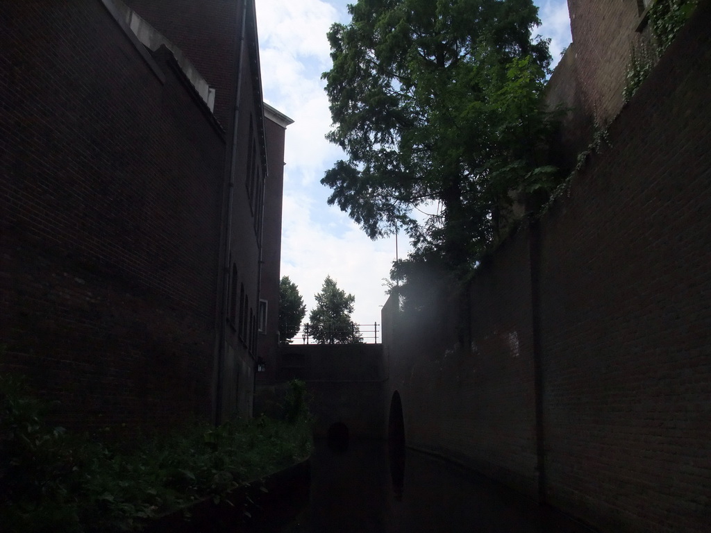 The Binnendieze river and the entrance to the Kruisbroedershekel tunnel, viewed from the tour boat