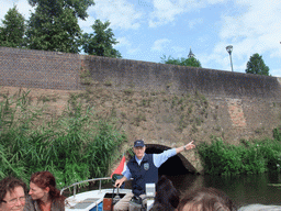 Our tour boat with the guide at the exit of the Kruisbroedershekel tunnel from the Binnendieze river to the Singelgracht canal