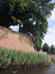 City wall at the Bastion Oranje and the Singelgracht canal, viewed from the tour boat