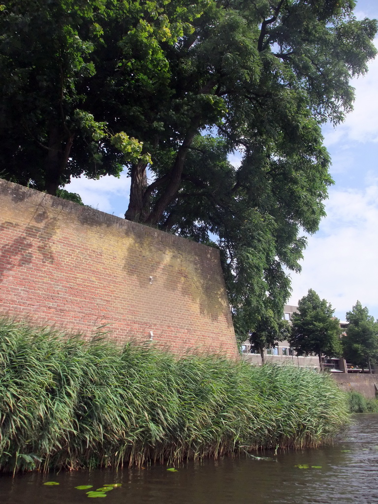 City wall at the Bastion Oranje and the Singelgracht canal, viewed from the tour boat