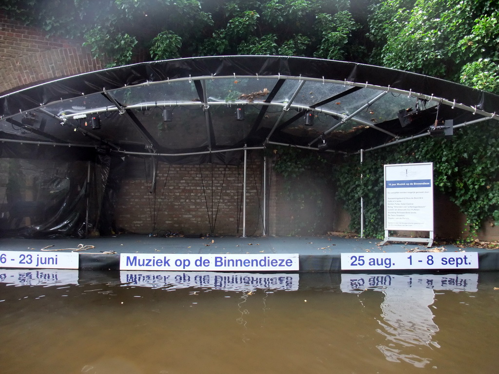 Stage below the Zuidwal street and the Binnendieze river, viewed from the tour boat