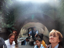 Our guide on the tour boat and bridges over the Binnendieze river