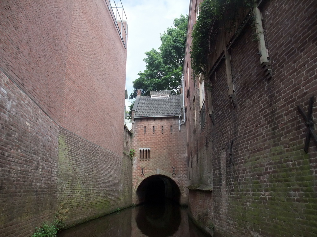 Building hanging over the Binnendieze river, viewed from the tour boat