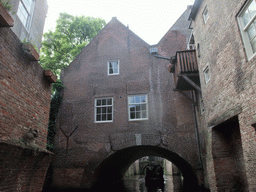 Building hanging over the Binnendieze river, viewed from the tour boat