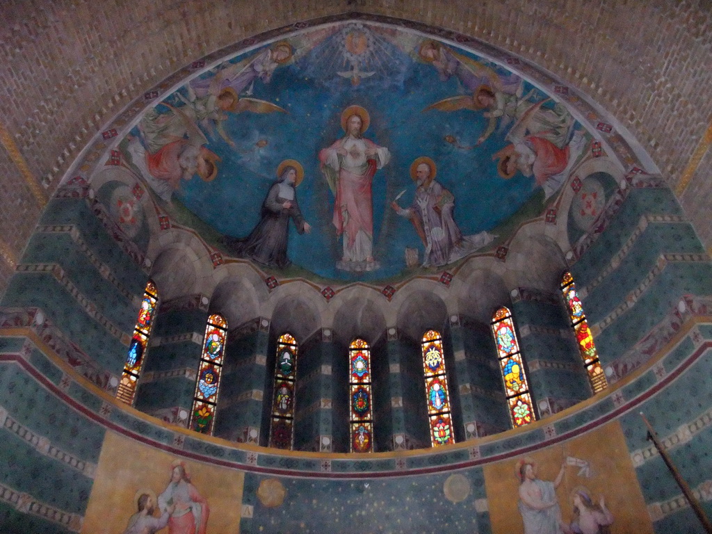 Frescoes and stained glass windows at the apse of the Hieronymus Bosch Art Center