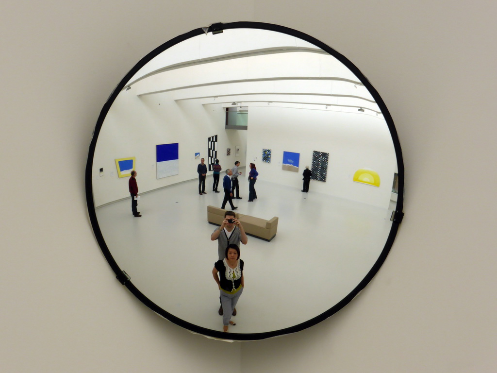 Tim and Miaomiao reflected in a mirror, with modern art at the Expo 4 hall at the Noordbrabants Museum