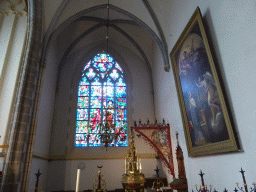 Stained glass window, painting and the copper baptismal font by Aert van Tricht at the baptistry of St. John`s Cathedral