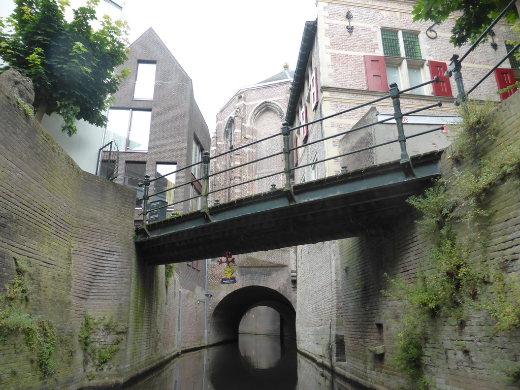 Bridge over the Binnendieze river and tunnel under the St. Catharina Church, viewed from the tour boat