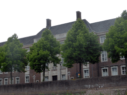 Building at the Spinhuiswal street and the city wall, viewed from the tour boat on the Singelgracht canal