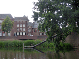 The Refugiehuis building at the Spinhuiswal street, the city wall and staircase from the Singelgracht canal, viewed from the tour boat