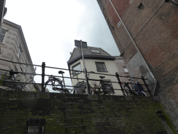 Bicycles at a street alongside the Binnendieze canal, viewed from the tour boat