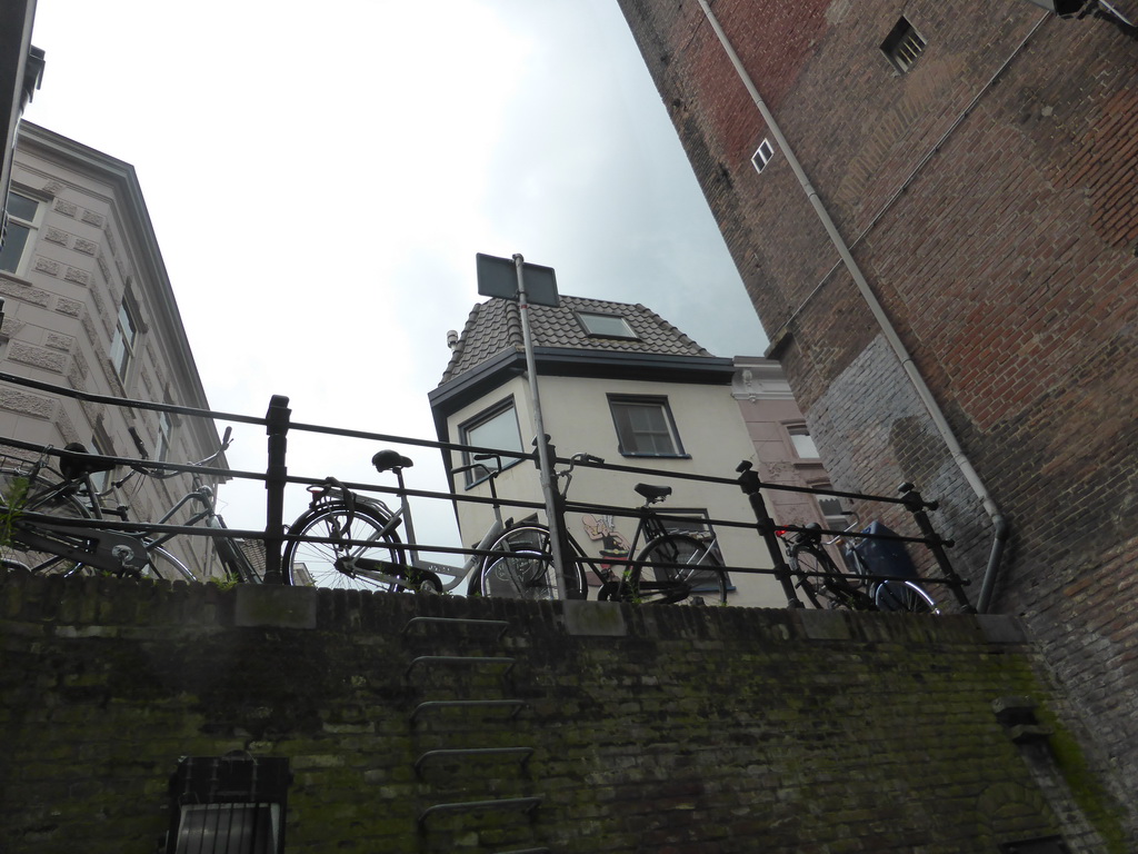 Bicycles at a street alongside the Binnendieze canal, viewed from the tour boat