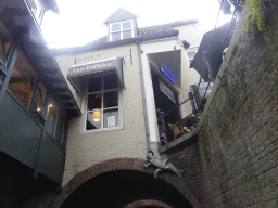 The Binnendieze canal and the Van Puffelen Restaurant at the Molenstraat street, viewed from the tour boat