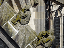 Flying Buttresses at the fifth row at the south side of St. John`s Cathedral: `Man with Milk Churn` and `Monkey with Cub`, viewed from the lower platform of the `Een Wonderlijke Klim` exhibition