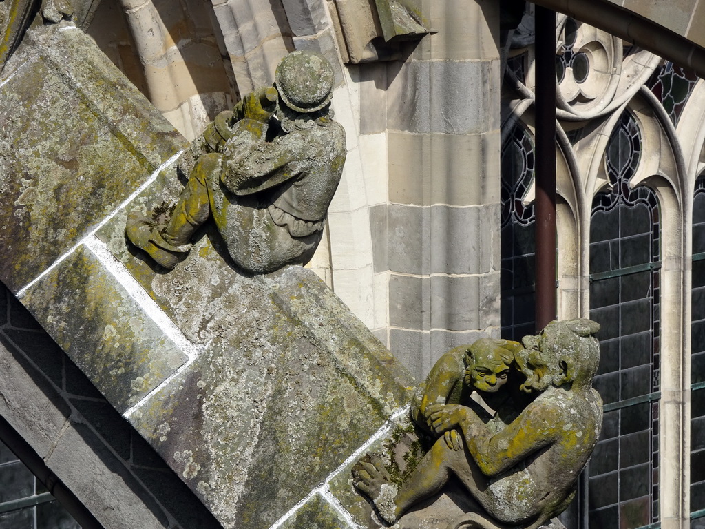 Flying Buttresses at the fifth row at the south side of St. John`s Cathedral: `Man with Milk Churn` and `Monkey with Cub`, viewed from the lower platform of the `Een Wonderlijke Klim` exhibition