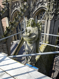 Angel statue at the southwest side of St. John`s Cathedral, viewed from the lower platform of the `Een Wonderlijke Klim` exhibition