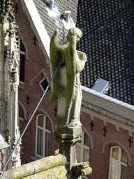 Angel statue at the south side of St. John`s Cathedral, viewed from the upper platform of the `Een Wonderlijke Klim` exhibition