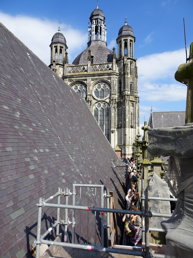 People in the gutter at the south side of St. John`s Cathedral, viewed from the upper platform of the `Een Wonderlijke Klim` exhibition