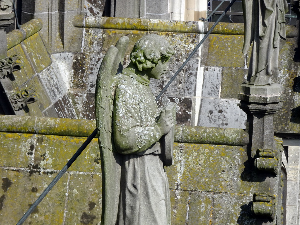 Angel statue at the south side of St. John`s Cathedral, viewed from the lower platform of the `Een Wonderlijke Klim` exhibition