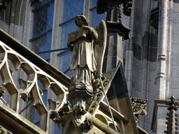 Angel statue at the north side of St. John`s Cathedral, viewed from the Torenstraat street