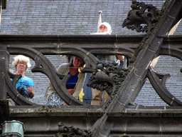 People in the gutter at the north side of St. John`s Cathedral, viewed from the Torenstraat street