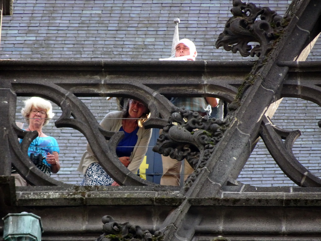 People in the gutter at the north side of St. John`s Cathedral, viewed from the Torenstraat street