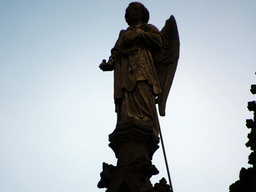Angel statue at the north side of St. John`s Cathedral, viewed from the Torenstraat street