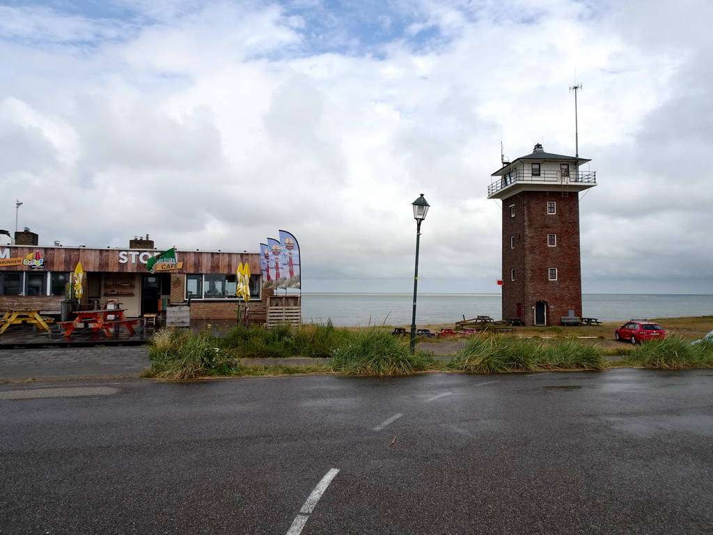 Front of the Beach Pavillion Storm aan Zee and the Kustwachttoren tower at the Admiraal Verhuellplein square at Huisduinen