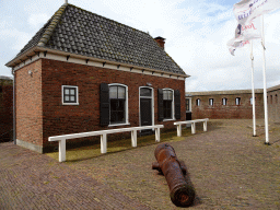 Building and cannon at the entrance to Fort Kijkduin